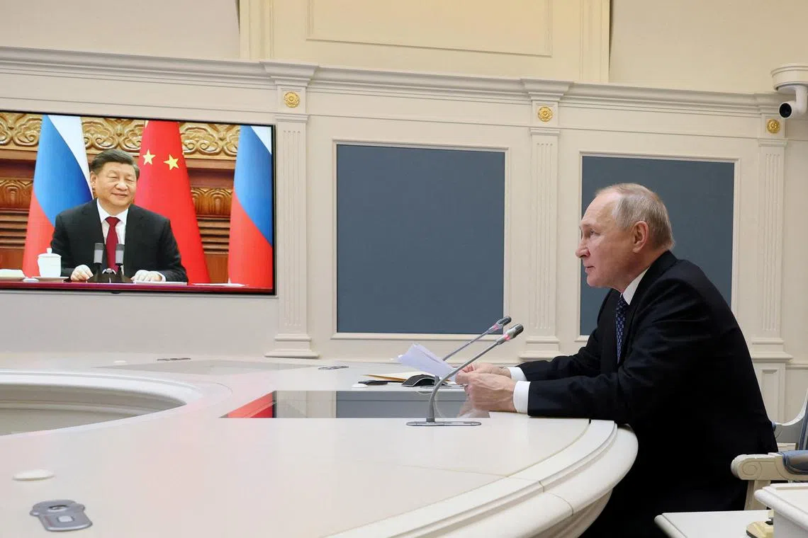 FILE PHOTO: Russia's President Vladimir Putin holds talks with China's President Xi Jinping via a video link from Moscow, Russia, December 30, 2022. Sputnik/Mikhail Kuravlev/Kremlin via REUTERS ATTENTION EDITORS - THIS IMAGE WAS PROVIDED BY A THIRD PARTY./File Photo
