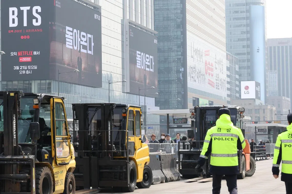 Workers set up the stage for a free concert by K-pop group BTS at Gwanghwamun Square, in Seoul, South Korea, on March 16, 2026. President Lee Jae Myung said that the government must focus on safety for the performance.