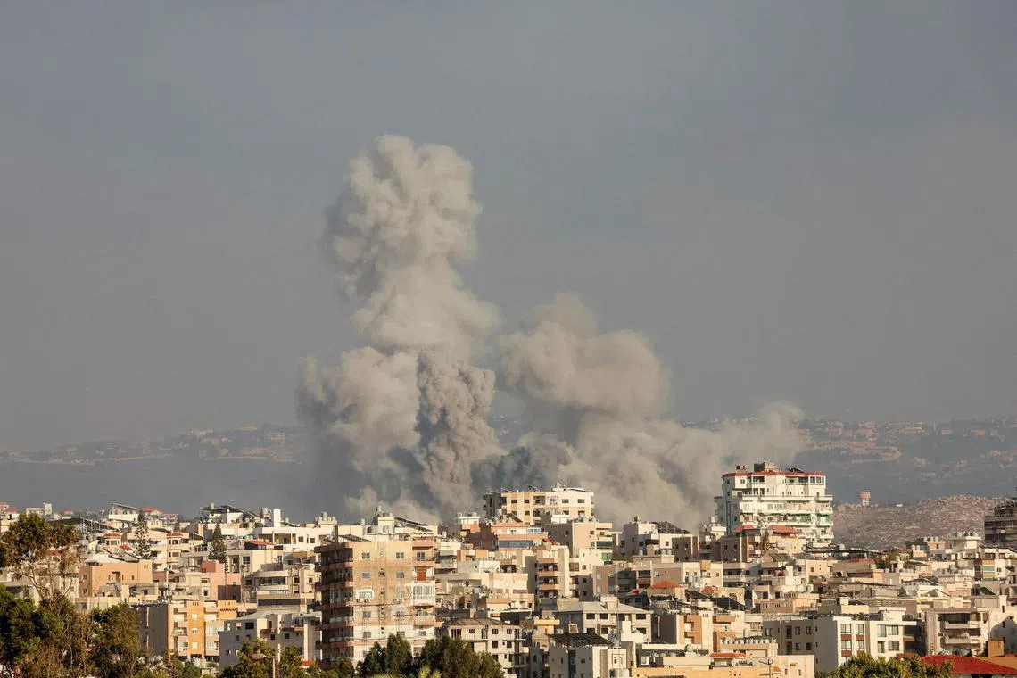 Smoke rises amid ongoing cross-border hostilities between Hezbollah and Israeli forces, in Tyre, southern Lebanon on Sept 23, 2024.    