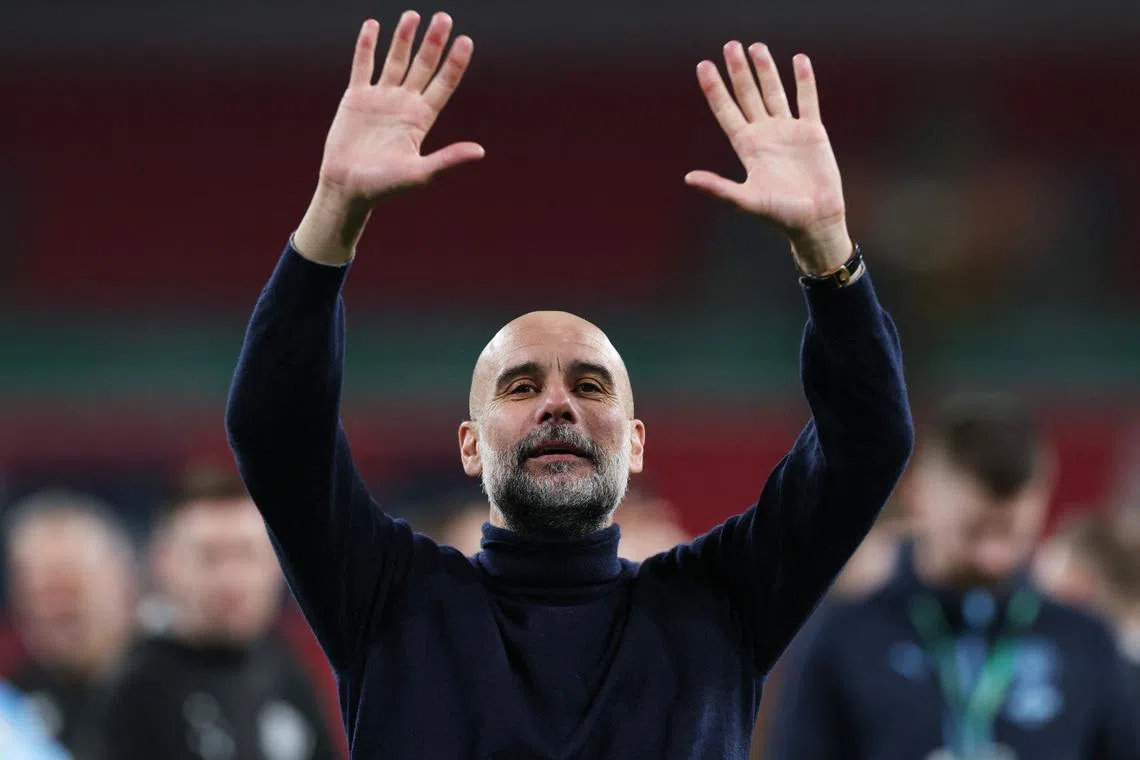 Soccer Football - Carabao Cup - Final - Arsenal v Manchester City - Wembley Stadium, London, Britain - March 22, 2026 Manchester City manager Pep Guardiola celebrates winning the Carabao Cup Action Images via Reuters/Paul Childs