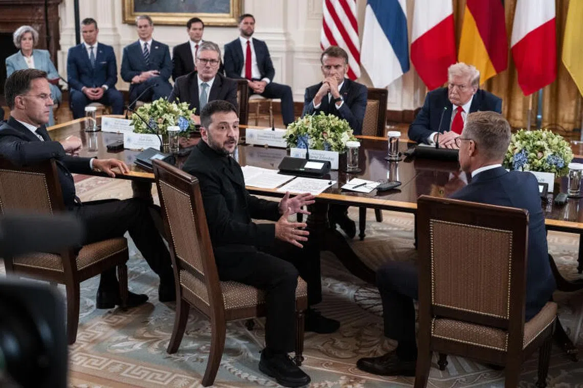 Ukrainian President Volodymyr Zelensky delivering remarks at a meeting with US President Donald Trump (second from right) and European leaders at the White House in Washington, on Aug 18.