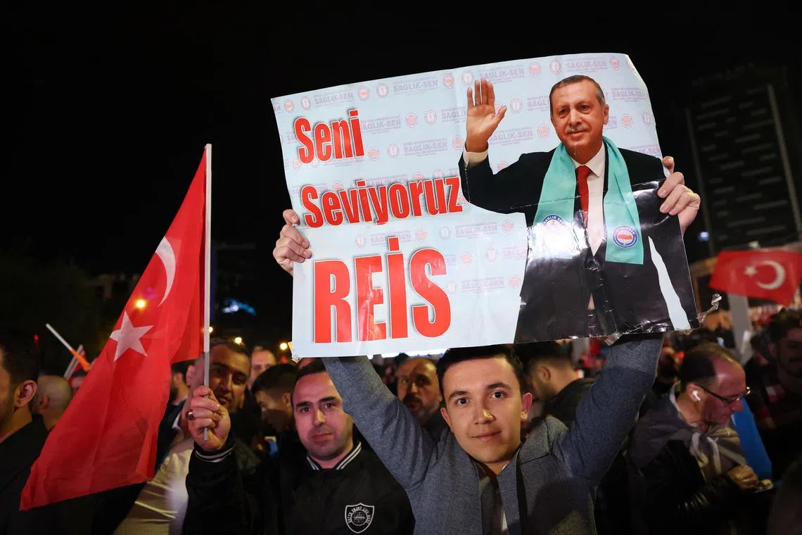 Supporters of Turkish President Tayyip Erdogan outside the AK Party headquarters after polls closed in Ankara, Turkey, on May 15, 2023. 