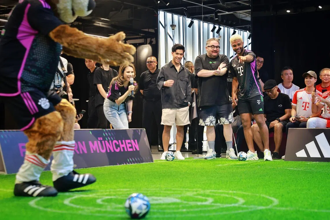 ST20230731_202382249143/dgsoc31/Deepan/Jason Quah

Bayern Munich player Serge Gnabry playing a game inspired by ‘goli’ (marbles) with fans during an event at the Adidas Brand Centre Orchard on July 31, 2023.