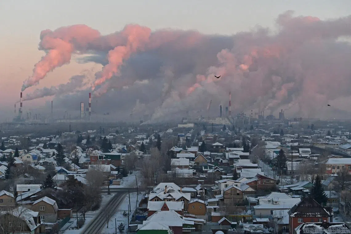 FILE PHOTO: Steam rises from chimneys of the Gazprom Neft's oil refinery in Omsk, Russia November 18, 2022. REUTERS/Alexey Malgavko/File Photo