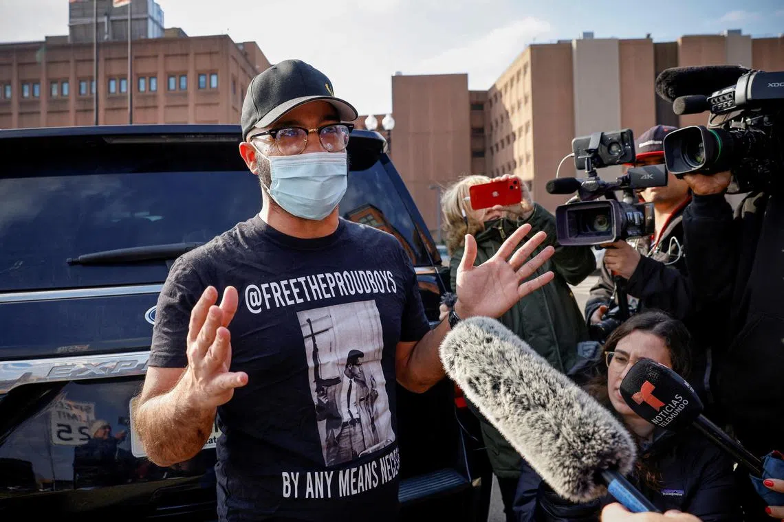 Proud Boys leader Enrique Tarrio speaks to the media following his release from detention.