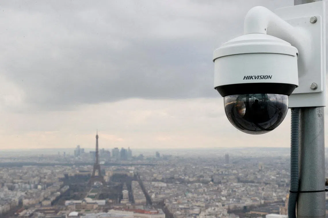 FILE PHOTO: A view shows a surveillance camera as French police start to test artificial intelligence-assisted video surveillance of crowds in the run-up to the Olympics in Paris, France, March 6, 2024. REUTERS/Abdul Saboor/File Photo