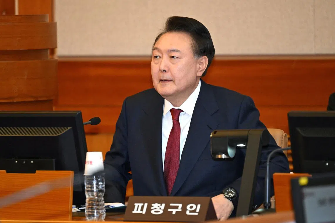 South Korea's impeached president Yoon Suk Yeol attends the fifth hearing of his impeachment trial over his short-lived imposition of martial law at the Constitutional Court in Seoul on February 4, 2025.     JUNG YEON-JE/Pool via REUTERS