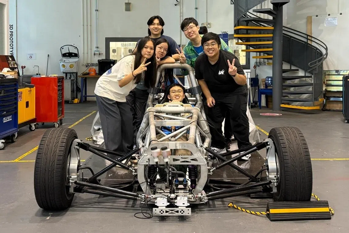 Students of NYP and SUTD work on and electric vehicle using EVAM.