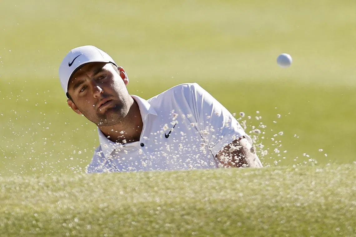 Scottie Scheffler, of the US, plays his shot from the bunker on the eighth hole, during day four of the WGC Match Play.