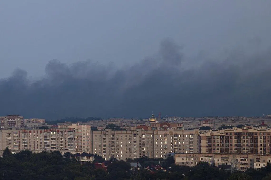 FILE PHOTO: Smoke rises over apartment buildings after a Russian drone strike, amid Russia's attack on Ukraine, in Lviv, Ukraine September 19, 2023. REUTERS/Stringer/File Photo