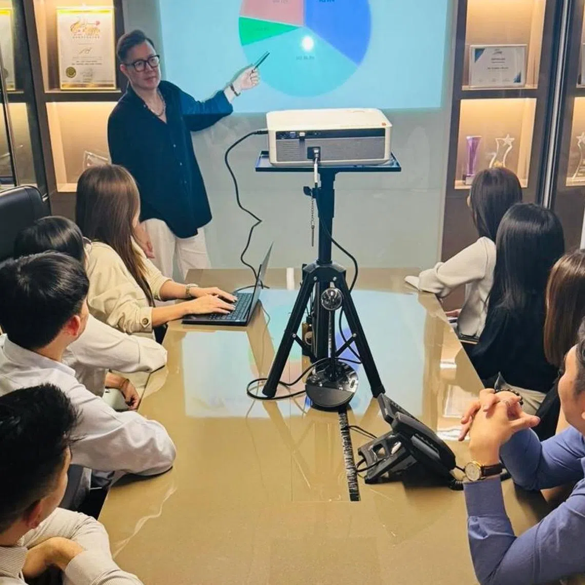 Mr Americ See (standing), managing director of ASL Global, shares that quality service helps the company stand out in a highly competitive industry.