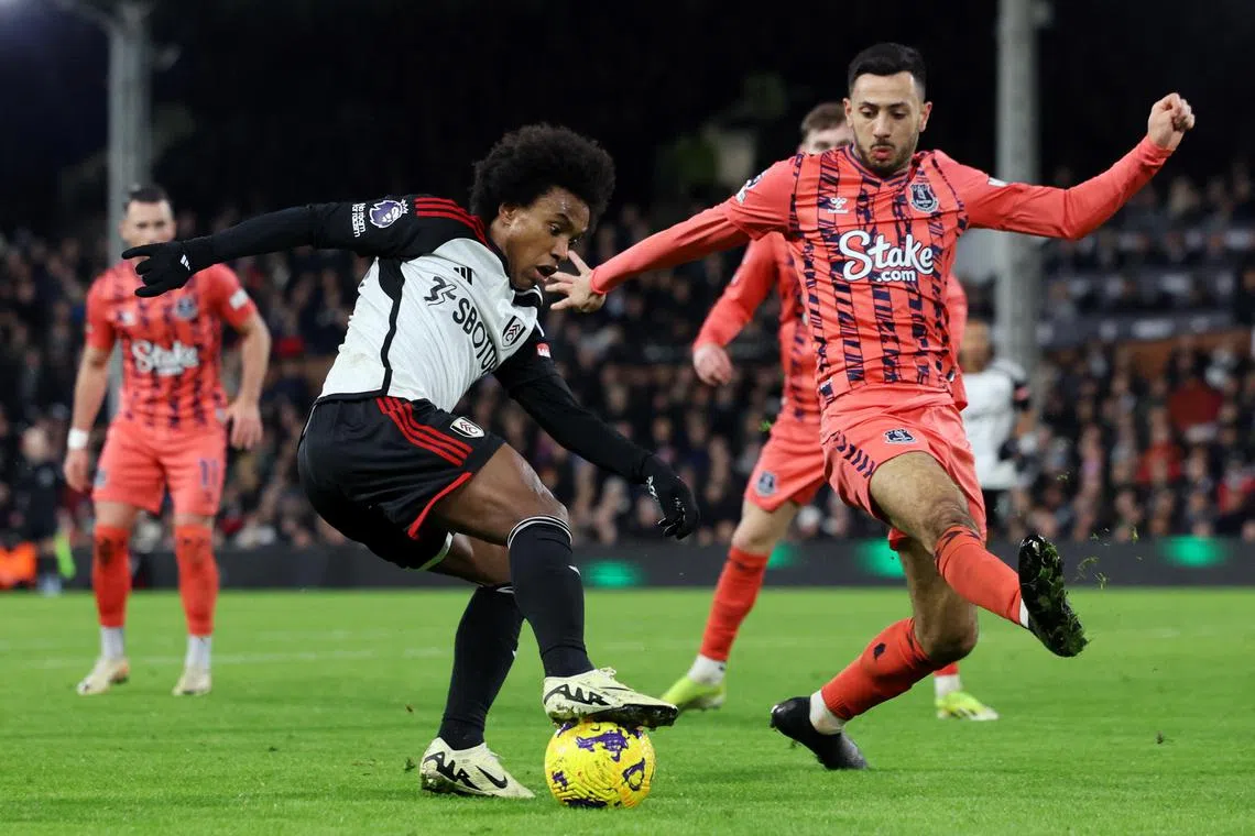 Everton's Dwight McNeil in action with Fulham's Willian.
