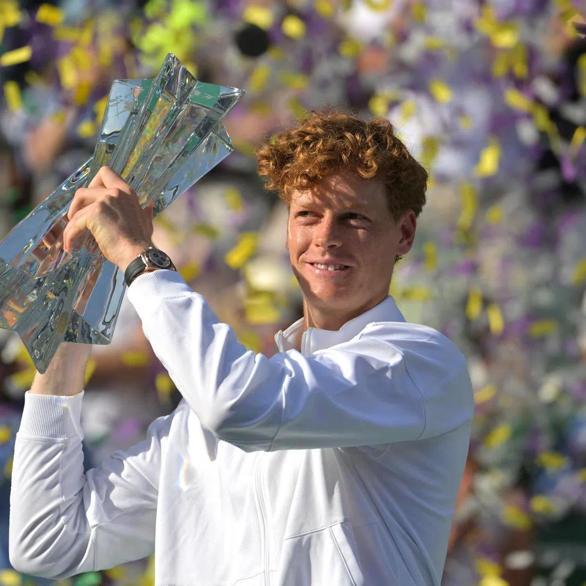 Mar 15, 2026; Indian Wells, CA, USA;  Jannik Sinner (ITA) celebrates with the championship trophy after he defeated Daniil Medvedev (RUS) in the menÕs final of the BNP Paribas Open at the Indian Wells Tennis Garden. Mandatory Credit: Jayne Kamin-Oncea-Imagn Images