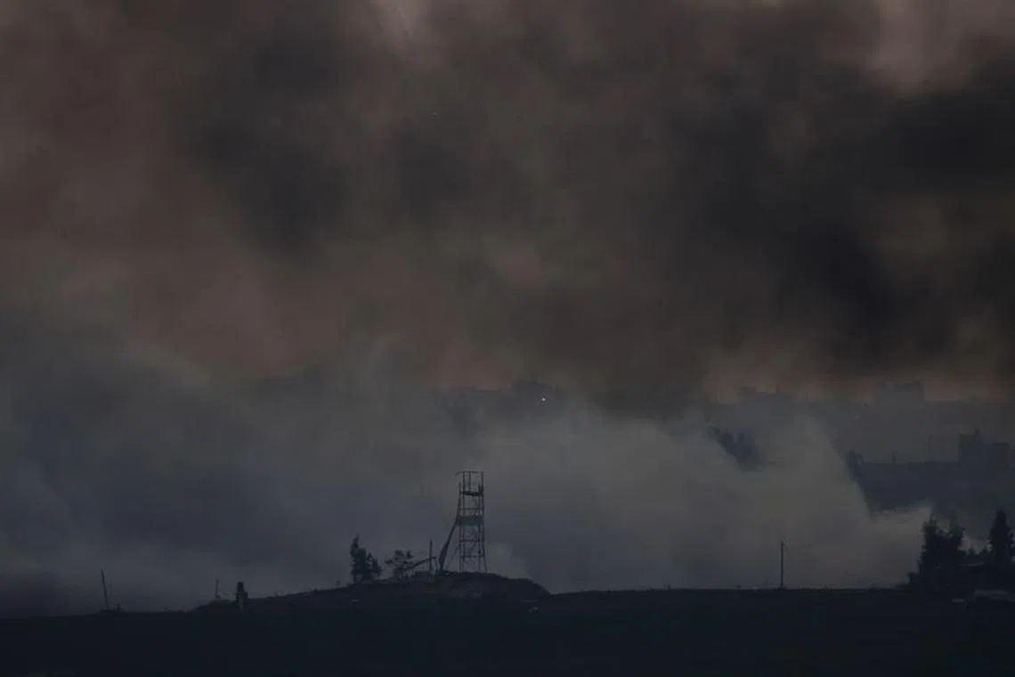 Smoke rises over Gaza, as seen from Israel's border with Gaza, in southern Israel October 28, 2023. REUTERS/Amir Cohen