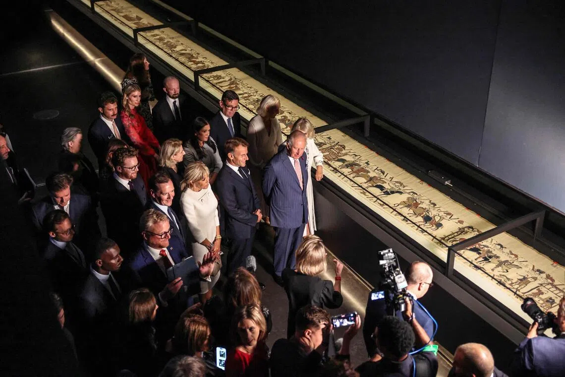 Britain’s King Charles III and Queen Camilla viewing the 1,000-year-old Bayeux Tapestry on Sept 2 at the British Museum in London, where it will be on display until July 2027.