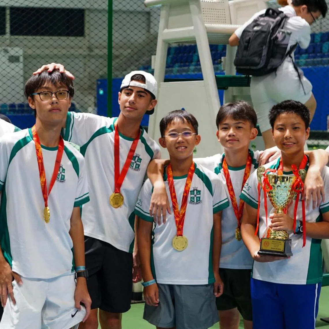 From left: St. Joseph's Institution's Raphael Goh, Gareth Kong, Asher Sandhu, Ng Shen Wei, Lim Yan Teng, Takuya Kaneko and Elias Siirtola posing with the C Division tennis trophy on Sept 1, 2025.