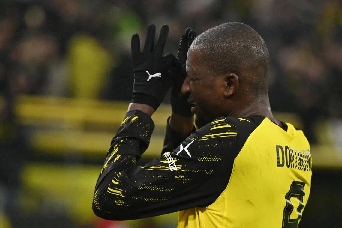 Soccer Football - Bundesliga - Borussia Dortmund v 1. FSV Mainz 05 - Signal Iduna Park, Dortmund, Germany - February 13, 2026 Borussia Dortmund's Serhou Guirassy celebrates scoring their third goal REUTERS/Teresa Kroeger