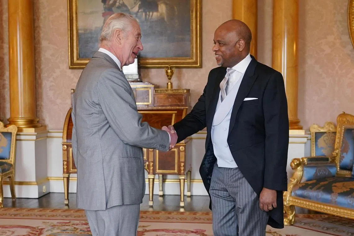 Britain's King Charles (left) holding an audience with Alexander Williams, the High Commissioner of Jamaica, at Buckingham Palace, on March 7, 2024.