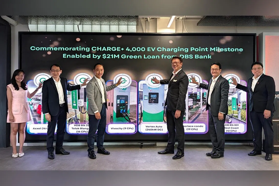Mr Ong Tze Boon (third from left), chairman of Charge+, says the operator is aiming for 30,000 charging points globally by 2030.