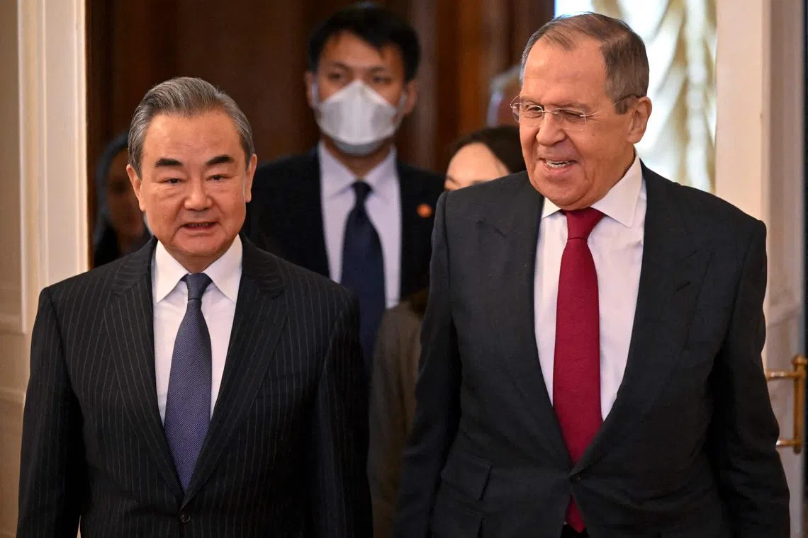 Russia's Foreign Minister Sergei Lavrov (right) and China's Foreign Minister Wang Yi meeting in Moscow, on Feb 22.