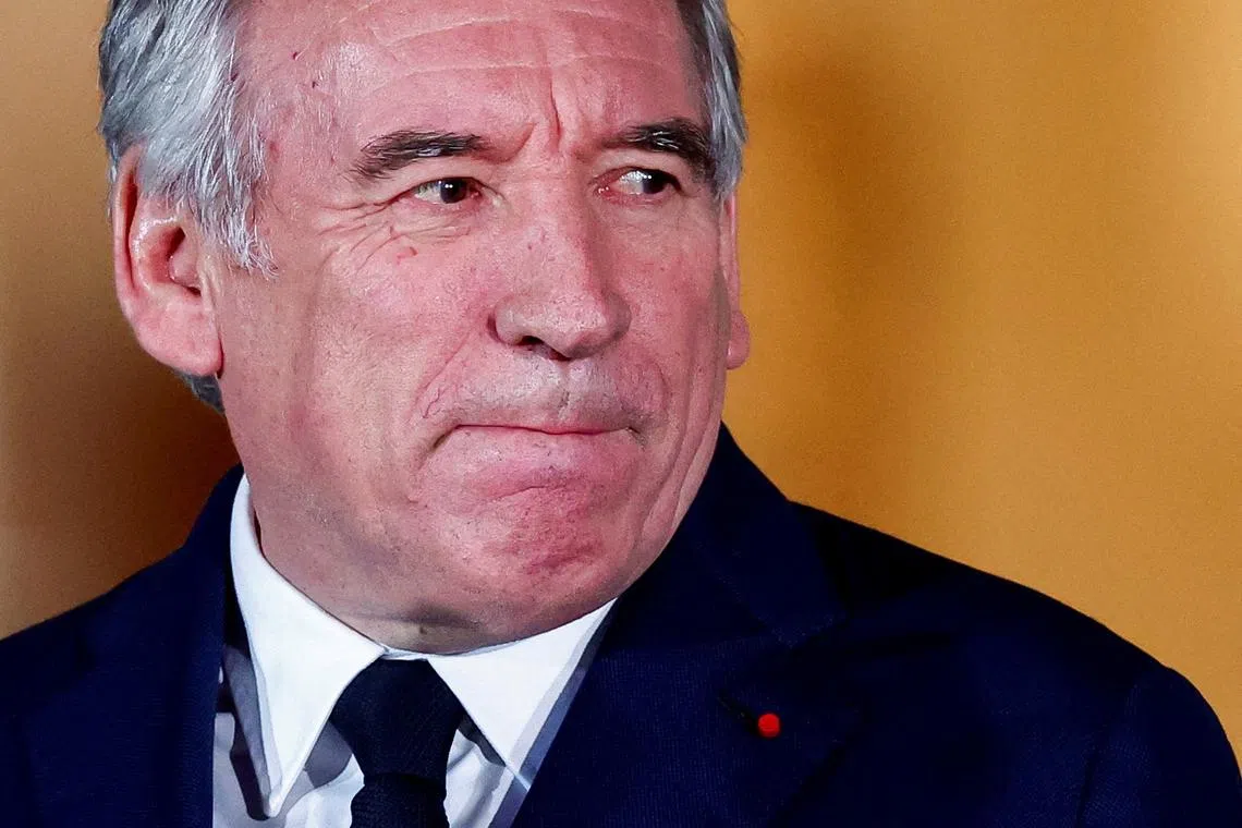 FILE PHOTO: France's newly appointed Prime Minister Francois Bayrou reacts on the day of the handover ceremony at the Hotel Matignon in Paris, France, December 13, 2024. REUTERS/Gonzalo Fuentes/File Photo