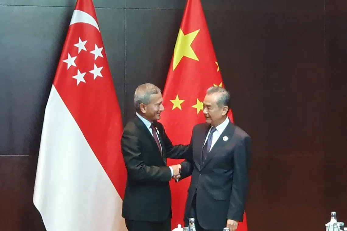 Foreign Minister Vivian Balakrishnan (left) meets Chinese Foreign Minister Wang Yi during their bilateral meeting in Vientiane on July 27.