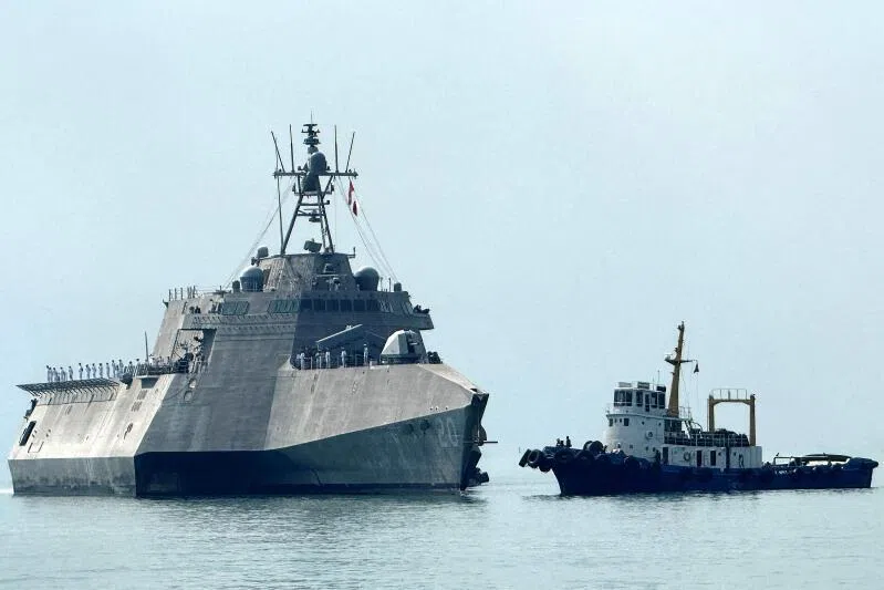 (Left) The US Navy's USS Cincinnati (LCS-20) littoral combat ship. President Donald Trump’s administration has touted its success at taking out suspected drug trafficking vessels in the area.
