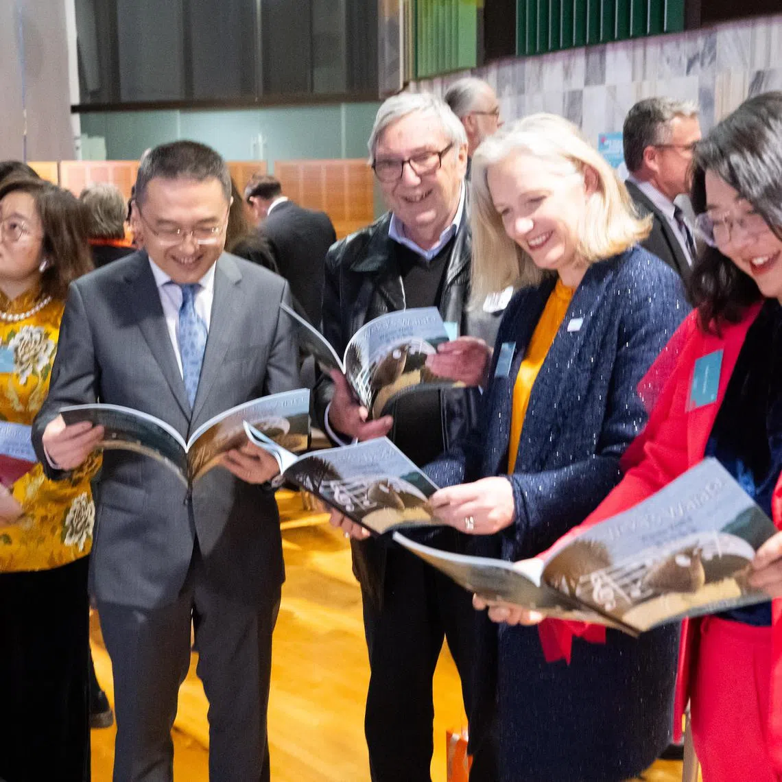 Ms Jo Coughlan (second from right) reading the trilingual children’s book Weka’s Waiata with guests at the launch of New Zealand Chinese Language Week, at the Beehive’s banquet hall, on Sept 18.