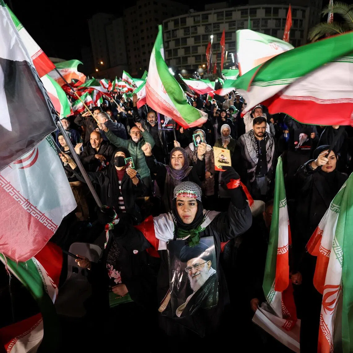 People attend a welcoming ceremony for Iran's women's national football team upon their return to the country.