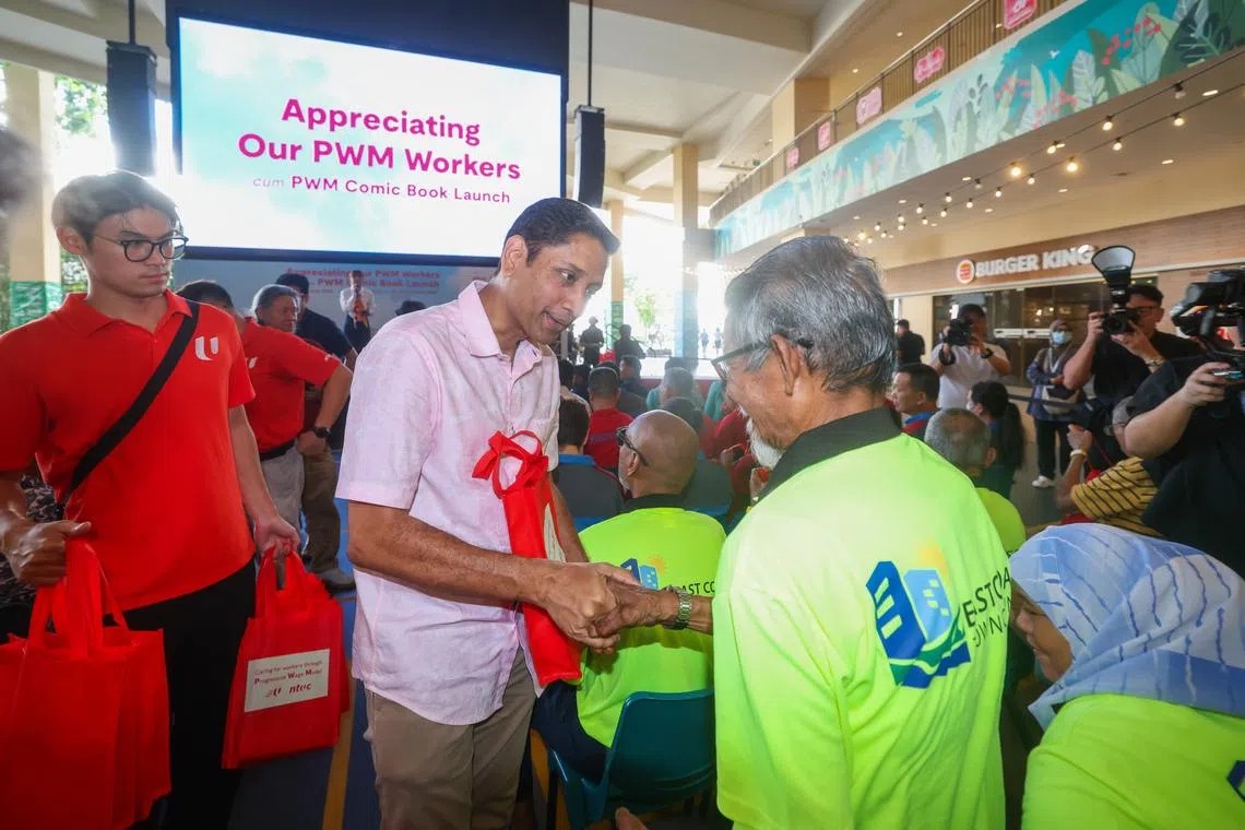Minister of State for Manpower Dinesh Vasu Dash presents appreciation packs to workers during the launch of NTUC’s “Appreciating Our PWM Workers” campaign at HeartBeat@Bedok