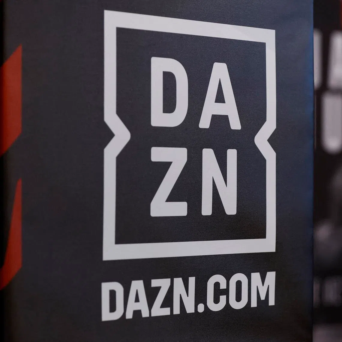 FILE PHOTO: Boxing - Anthony Joshua and Robert Helenius Press Conference - Pan Pacific London, London, Britain - August 9, 2023 A DAZN signage is pictured during the press conference Action Images via Reuters/Peter Cziborra/File Photo