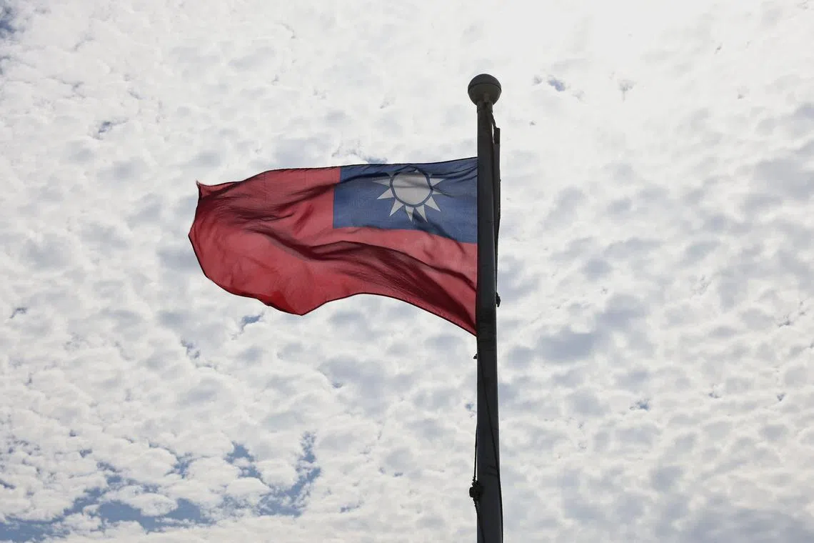 FILE PHOTO: A Taiwanese flag flaps in the wind in Taoyuan, Taiwan, June 30, 2021. REUTERS/Ann Wang/File Photo