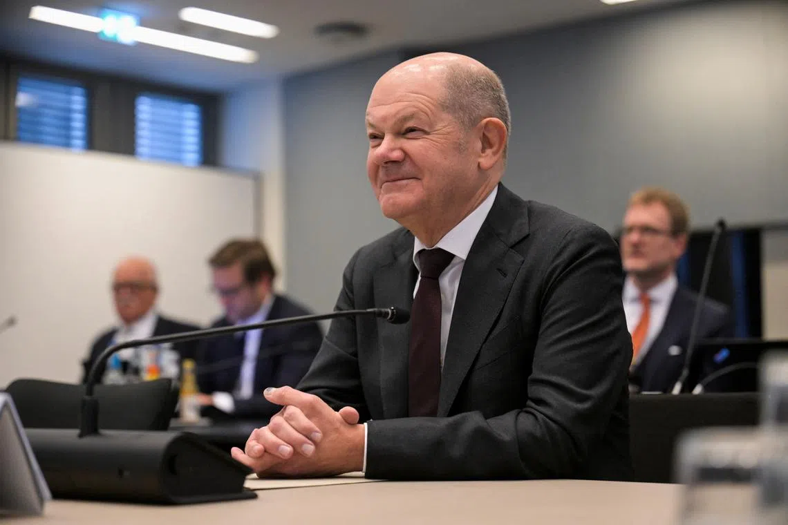Germany's Chancellor Olaf Scholz attends a session to answer parliamentarians' questions on Cum-Ex affair, at the plenary hall in the town hall, in Hamburg, Germany, December 6, 2024. REUTERS/Fabian Bimmer