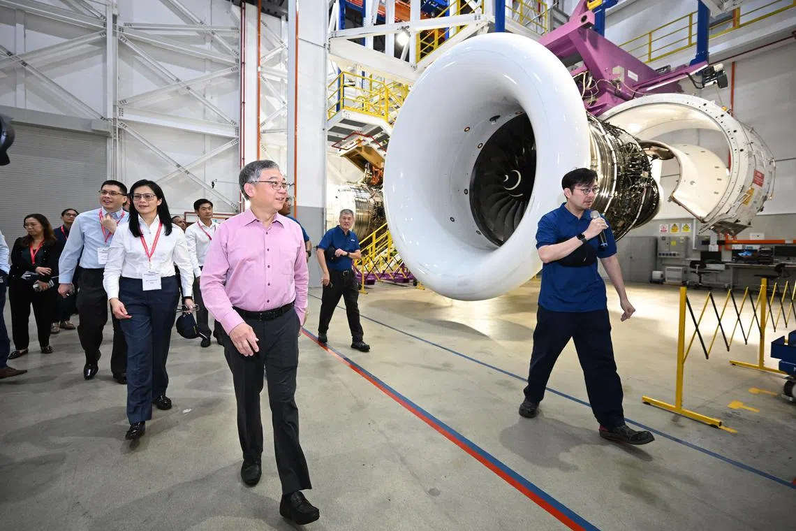 ST20250116-202587400208-Lim Yaohui-Kok Yufeng-yfsaesl16/
Deputy Prime Minister and Minister for Trade and Industry Gan Kim Yong walking past the Trent XWB engine in the engine preparation area in SAESL Test Cell on Jan 16, 2025.
Singapore Aero Engine Services Private Limited (SAESL), a leader in Rolls-Royce Trent engine maintenance, repair, and overhaul (MRO) services, announces the groundbreaking of its new facility in Loyang and the expansion into Seletar Aerospace Park. Deputy Prime Minister and Minister for Trade and Industry Gan Kim Yong graced this event as the Guest-of-Honour.
(ST PHOTO: LIM YAOHUI)