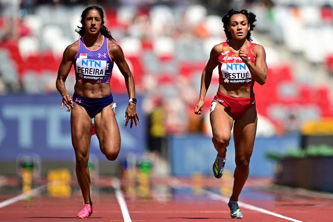 Shanti Pereira (left) is beaten by Spain's Jael Bestue to third in their 100m heats at the World Athletics Championships on Sunday. The Singaporean did not qualify for the semi-finals.