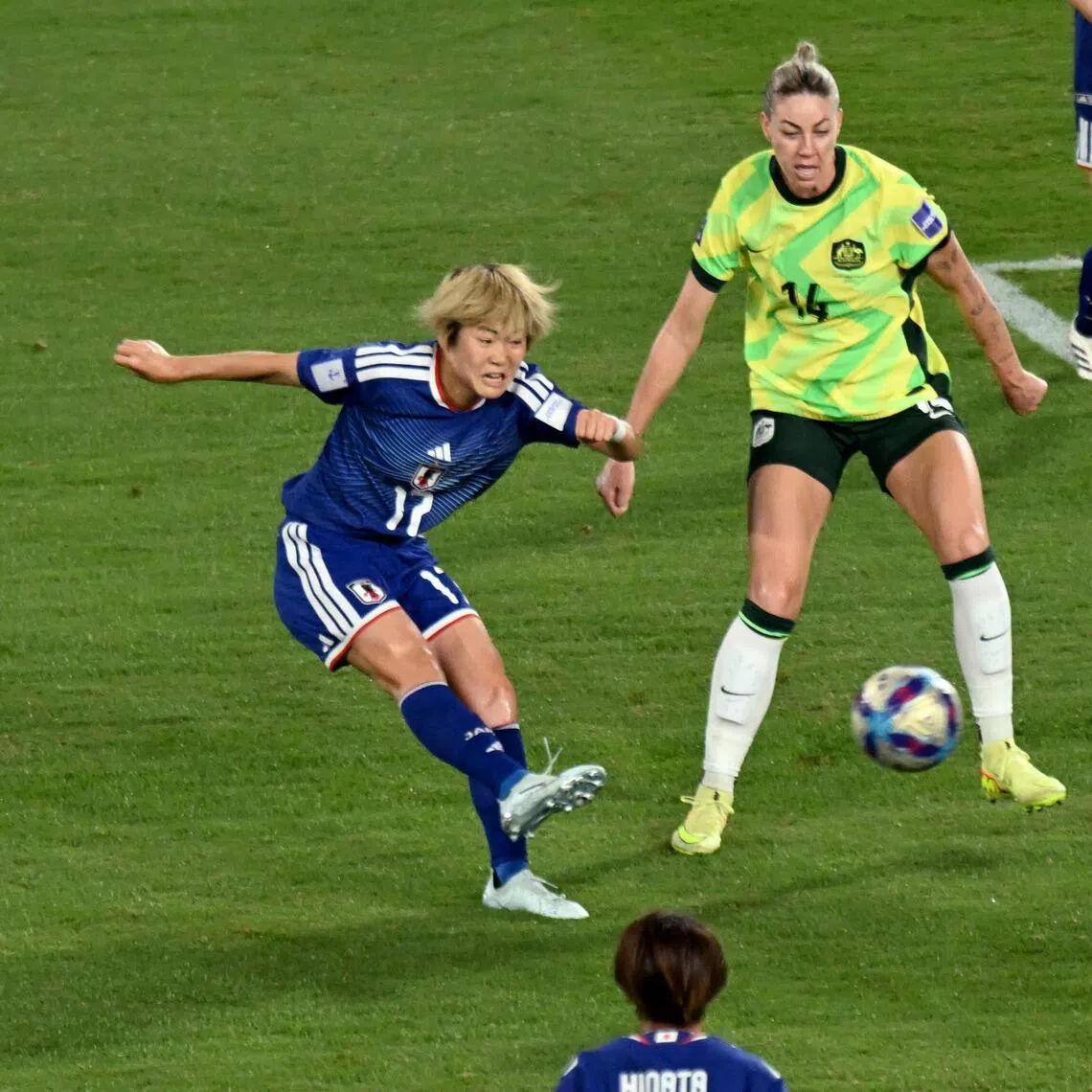 Japan's Maika Hamano (left) shoots and scores the winning goal during the final of the AFC Women’s Asian Cup.