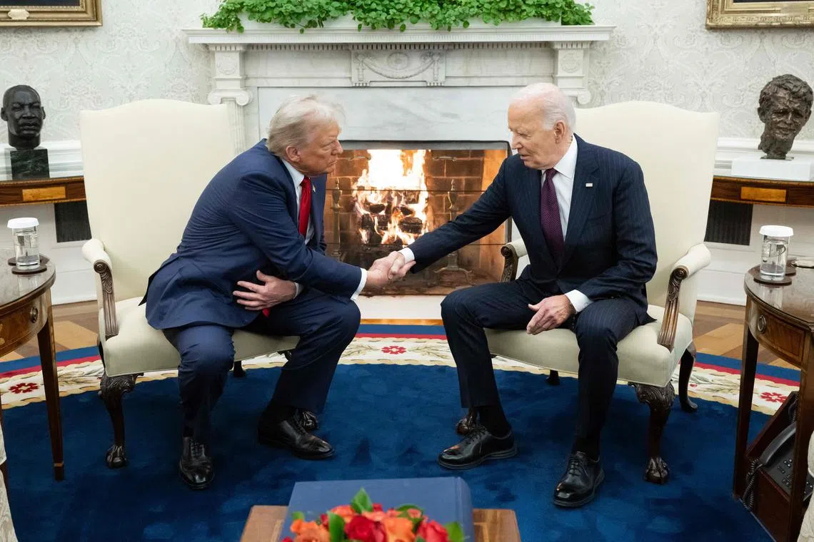 US President-elect Donald Trump (left) shaking hands with US President Joe Biden during his Nov 13 visit to the White House.