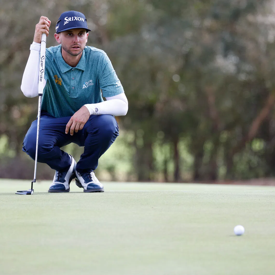 FILE PHOTO: Jan 9, 2026; Lecanto, Florida, United States; John Catlin lines up his putt on the eighteeth green during the second round of the LIV Golf Black Diamond Ranch golf tournament at Black Diamond Ranch. Mandatory Credit: Jeff Swinger-Imagn Images/File Photo
