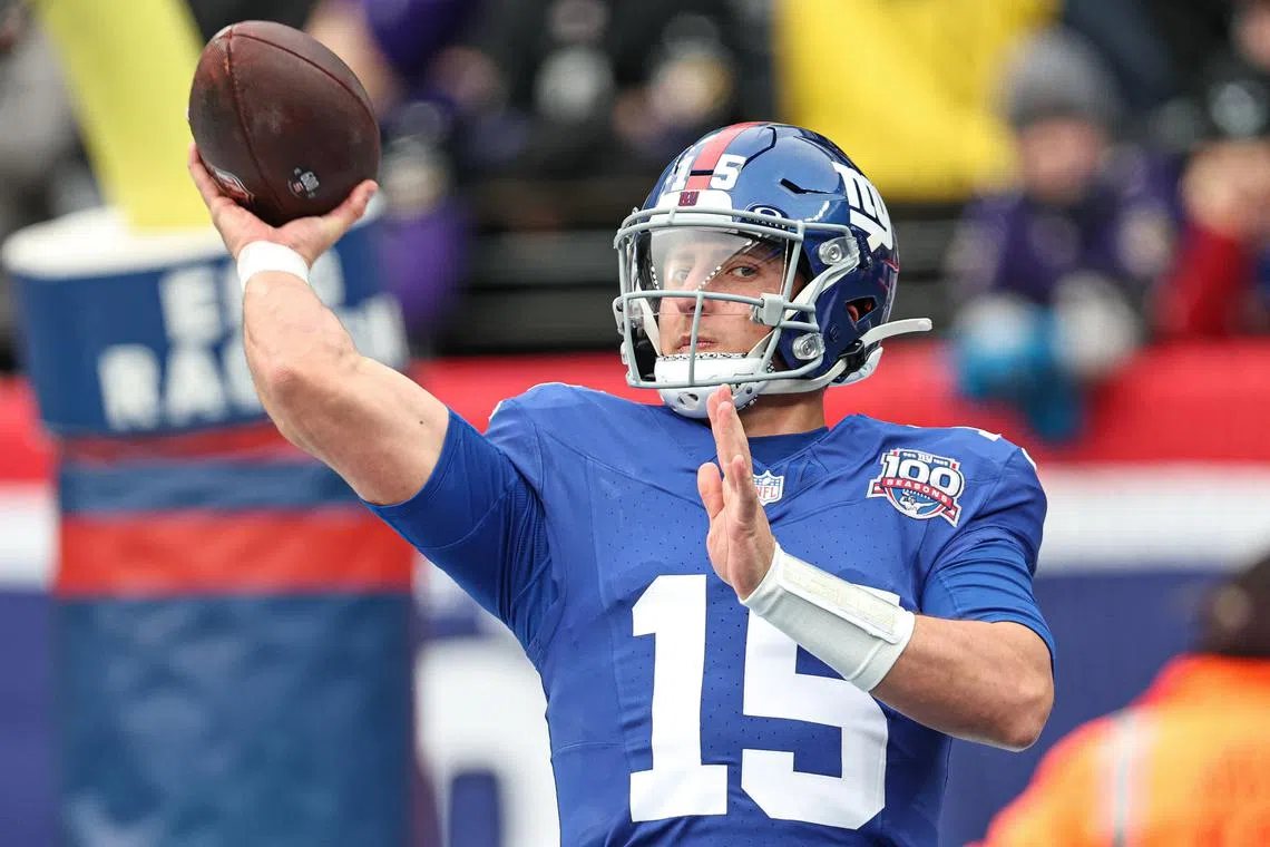 Dec 15, 2024; East Rutherford, New Jersey, USA; New York Giants quarterback Tommy DeVito (15) warms up before the game against the Baltimore Ravens at MetLife Stadium. Mandatory Credit: Vincent Carchietta-Imagn Images