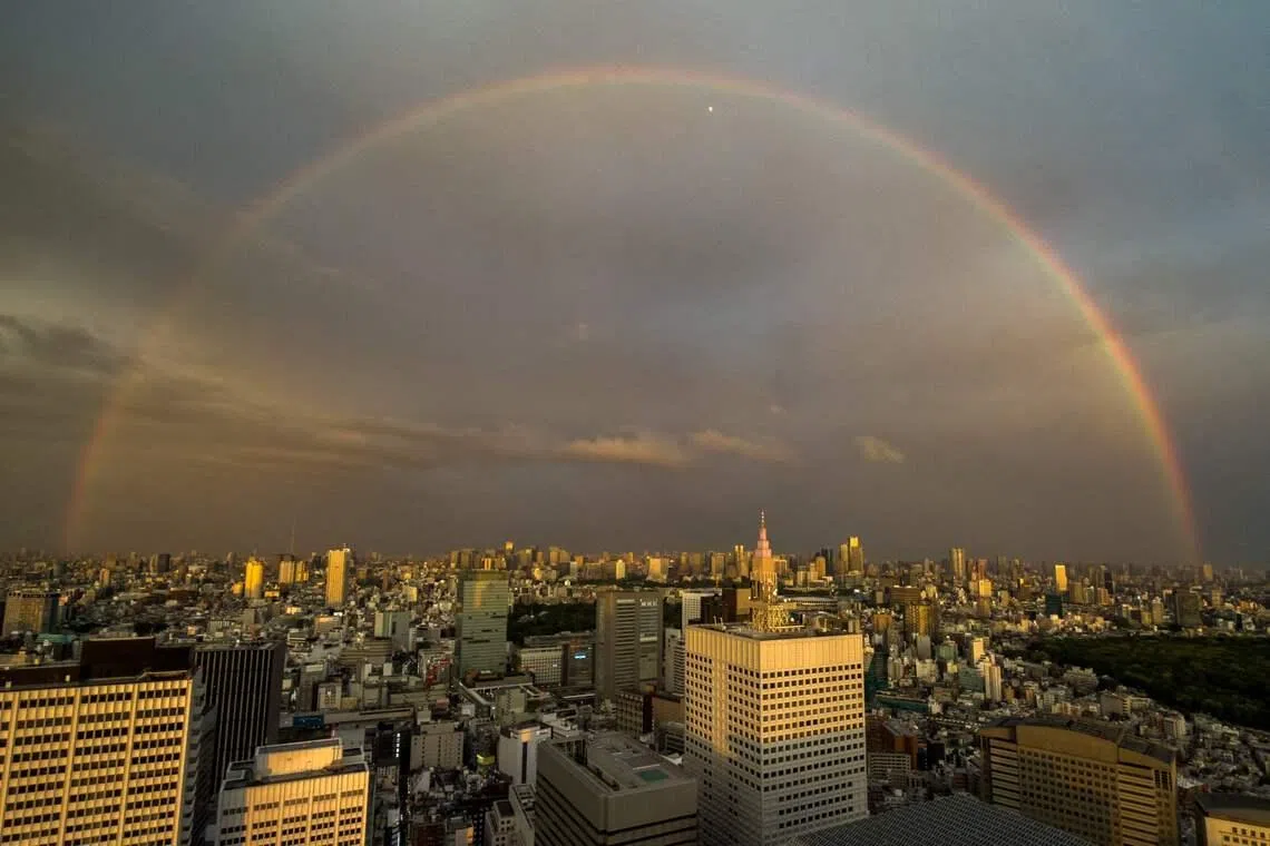 A rainbow over the city skyline in the Shinjuku district of central Tokyo, on April 27, 2026. 