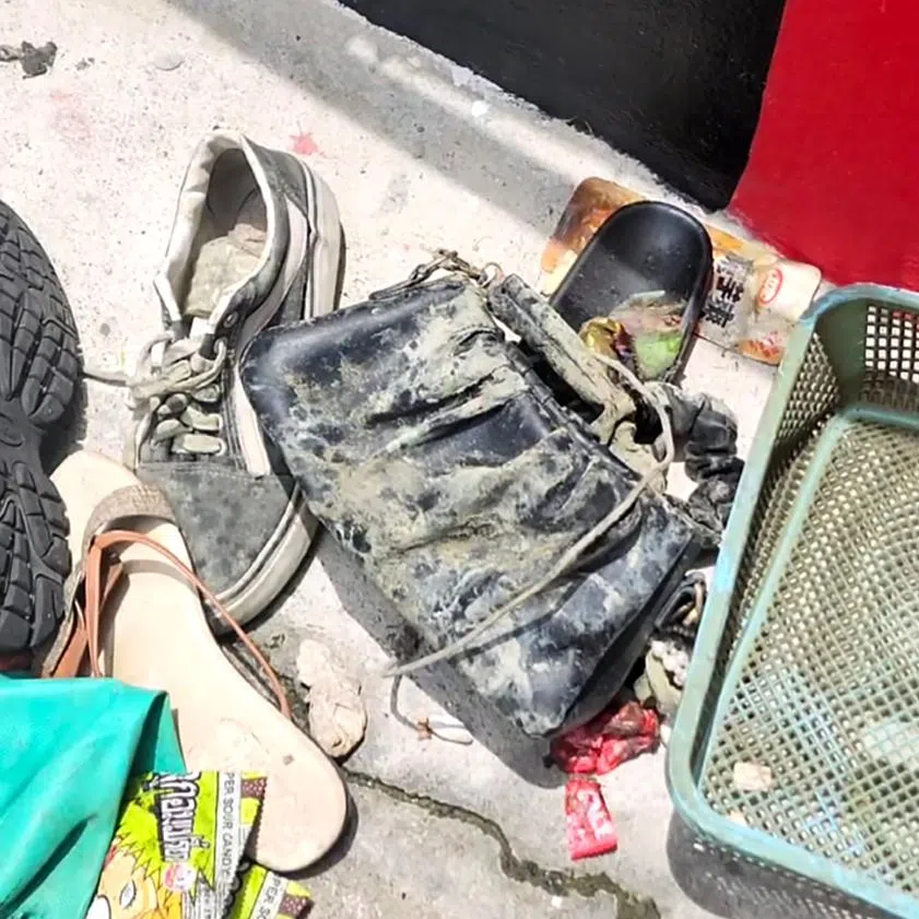 Burnt objects found outside the Rong Beer Na Lat Phrao bar and restaurant in Bangkok, where a fire had broken out close to midnight on July 12.