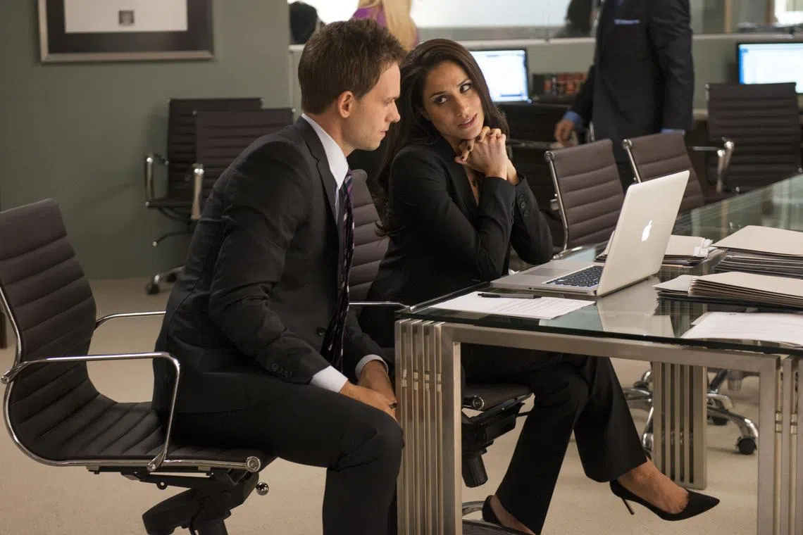 Television Still: Suits, starring Patrick J. Adams (left) and Meghan Markle.