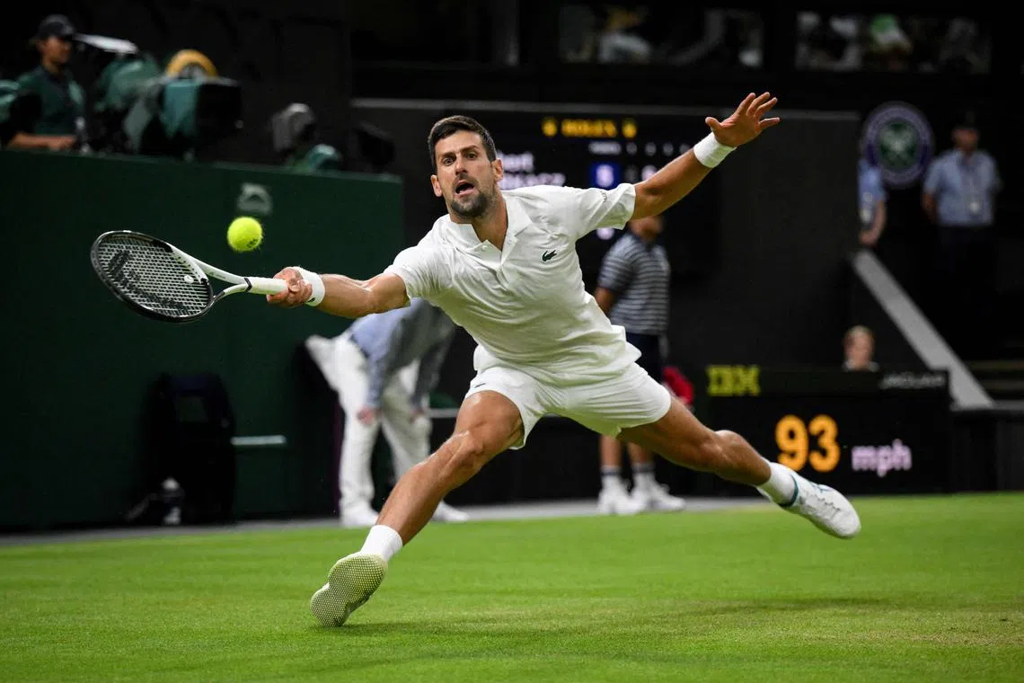 Serbia's Novak Djokovic returns the ball to Poland's Hubert Hurkacz during their men's singles tennis match.