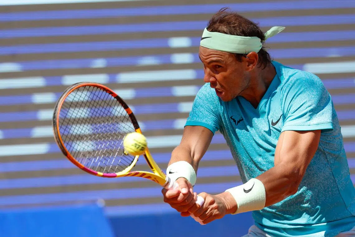 Rafael Nadal returns the ball to Duje Ajdukovic during their semi-final match at the Swedish Open.