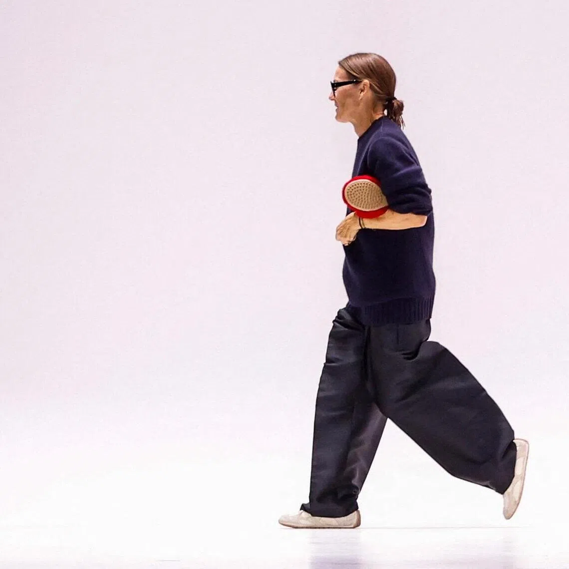 Designer Louise Trotter appears at the Bottega Veneta Spring/Summer 2026 collection show during Fashion Week in Milan, Italy, September 27, 2025. REUTERS/Alessandro Garofalo