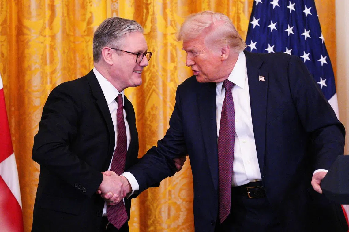 British Prime Minister Keir Starmer and U.S. President Donald Trump shake hands during a joint press conference in the East Room at the White House, February 27, 2025 in Washington, D.C., U.S. Carl Court/Pool via REUTERS