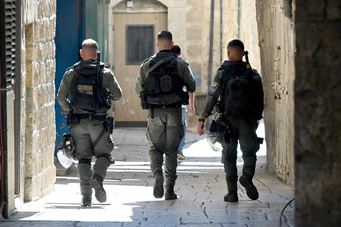 Israeli security forces patrol the narrow streets in Jerusalem's Old City on October 13, 2023, amid the ongoing battles between Israel and the Palestinian Islamist group Hamas. (Photo by YURI CORTEZ / AFP)