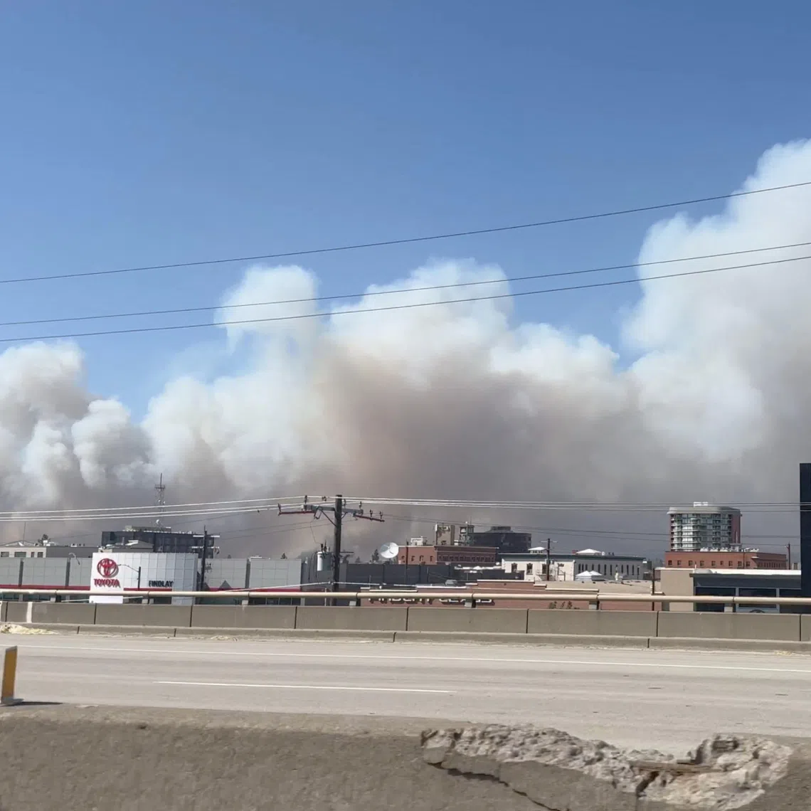 Massive plumes of smoke rise over the US city of Spokane due to wildfires.
