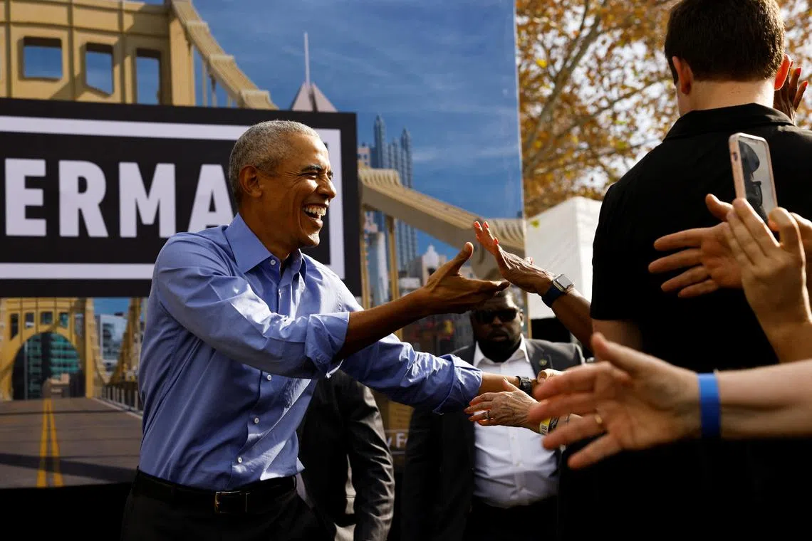 Former US president Barack Obama greets people as he campaigns for John Fetterman, Pennsylvania Democratic nominee for the US Senate, in Pittsburgh.
