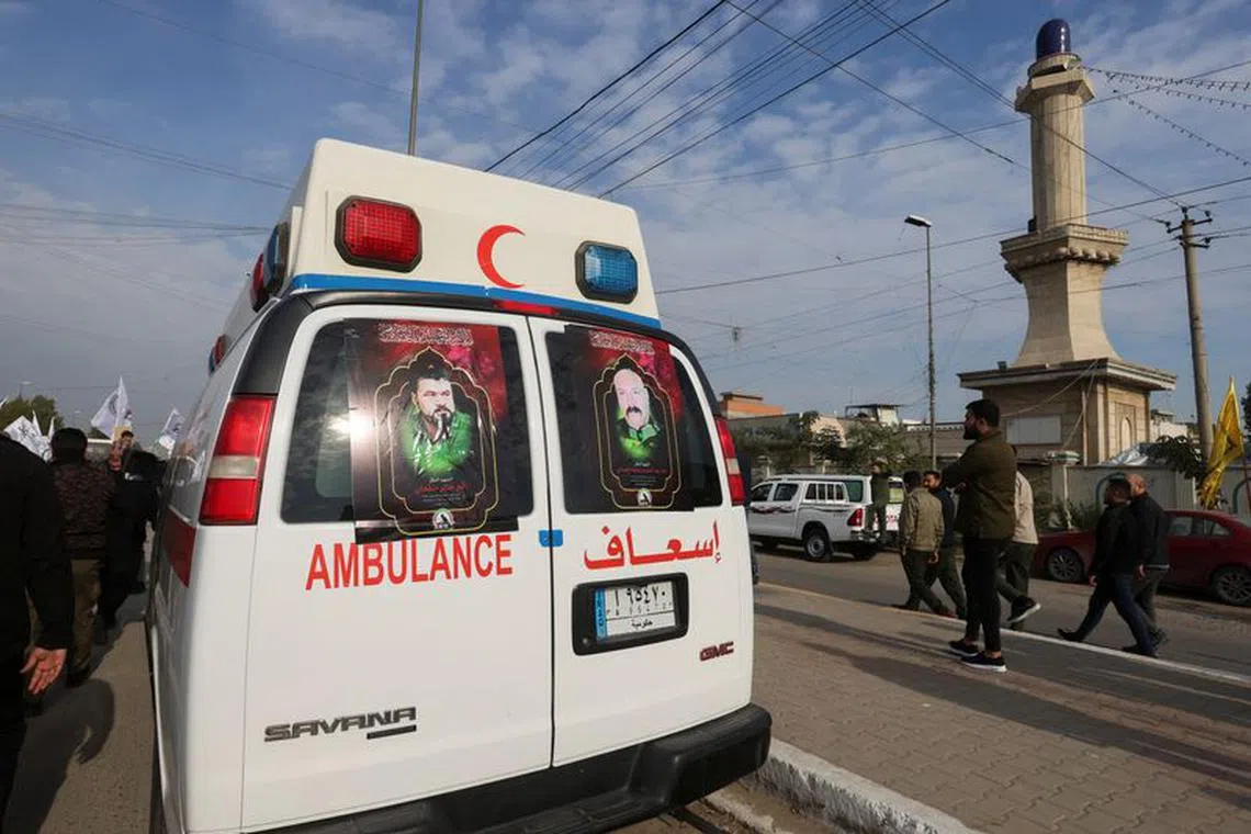 FILE PHOTO: Ambulances carry the coffins of Iraqi Shi'ite armed group members who were killed by a U.S. air strike in al-Qaim, during a funeral in Baghdad, Iraq February 4, 2024. REUTERS/Ahmed Saad
